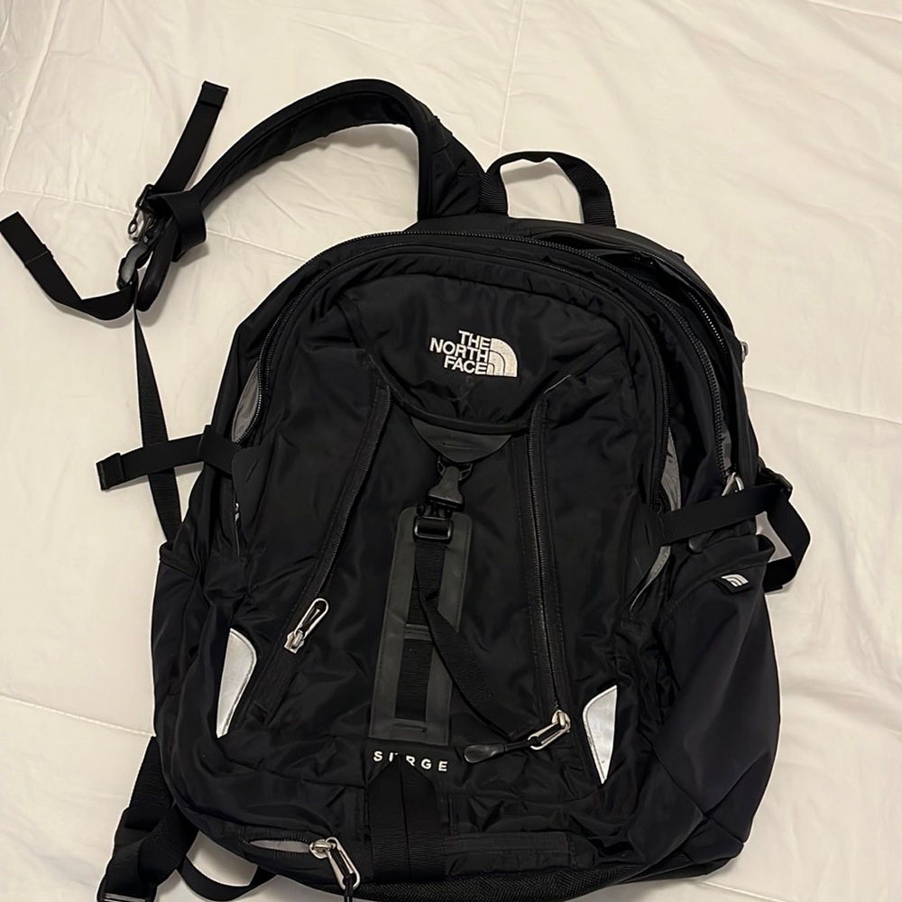 Lightly used north face Surge laptop backpack. Black
